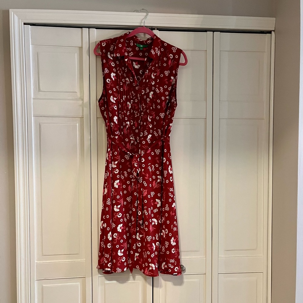 dip burgundy sleeveless dress; front buttons; tie around waist; falls below knee